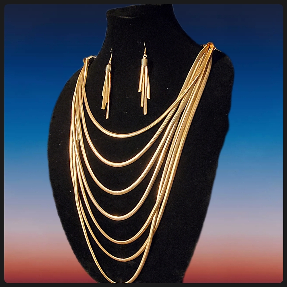 Multi Strand Gold Necklace with Earrings.